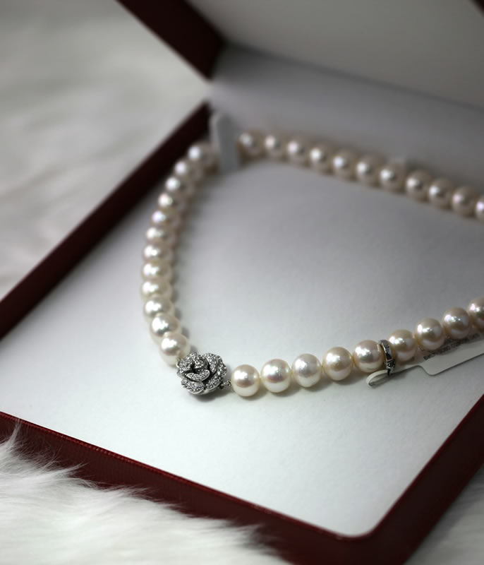 Elegant pearl necklace displayed in a jewelry box